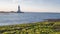 Lighthouse on seashore, marine navigation