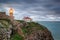 Lighthouse shines out to sea ships. Sagres Cabo Sao Vicente