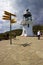 Lighthouse and signpost at Cape Reinga, Northland, New Zealand