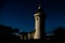 Lighthouse silhouette in reflection