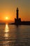 Lighthouse silhouette at sunset