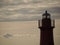 Lighthouse silhouette at sunset