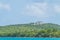 Lighthouse sits on a hill in Fajardo Puerto Rico surrounded by palm trees