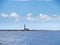 Lighthouse on a small rocky island close to Ibiza Balearic Islands