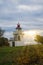 Lighthouse, Spodsbjerg Fyr in Huntsted on the coast of Denmark. Sun rays shining