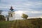 Lighthouse, Spodsbjerg Fyr in Huntsted on the coast of Denmark. Sun rays shining