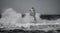 Lighthouse storm - mangiabarche lighthouse during a winter swell