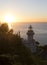 Lighthouse and sunset over the coast in San Sebastian