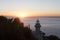 Lighthouse and sunset over the coast in San Sebastian