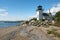 Lighthouse Surrounded with Rocks for Protection from Rising Tide