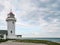 Lighthouse tower on a beach.