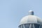 Lighthouse tower and blue summer sky, the safe return of the shi