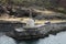 Lighthouse tower mounted at breakwater of Vestmannaeyjar port