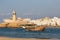 Lighthouse and traditional boat in Sur, Oman