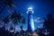 lighthouse on a tropical island at night