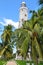 Lighthouse and tropical palms