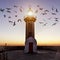 The lighthouse with turned light and flying birds around..