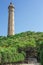 Lighthouse under blue sky and cloud