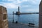 Lighthouse at Venetian harbour of the Old Town of Chania Crete, Greece. View from Firkas Fortress