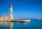 Lighthouse and wall at old Venetian harbour in Rethymno Crete Gr