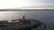 Lighthouse on the west breakwater in Nowy Port at sunset, GdaÅ„sk.