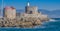 Lighthouse and windmills and the Aegean Sea at Rhodes