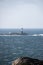 Lighthouse in winter storm Atlantic ocean