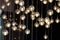 lighting balls on the chandelier in the lamplight, light bulbs hanging from the ceiling, lamps on the dark background