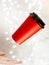 Lighting bokeh, red paper cup for coffee flying