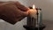 Lighting A Candle With Christian Cross
