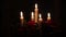 Lighting A Candle With A Match To Get A Romantic Candlelight. Amazing andles and candlesticks are on the table. Stay