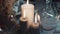 Lighting candle on wood table. candle flames in darkness, Slowly reversing the camera. Slow motion