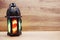 Lighting with colorful on muslim lantern shining on wooden background