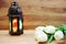 Lighting with colorful on muslim lantern shining on wooden background