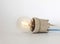 Lighting incandescent lamp bulb with cap, socket, wires lies on white background, new idea concept