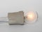 Lighting incandescent lamp bulb with cap, socket, wires lies on white background, new idea concept