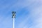 Lighting mast lantern construction on blue sky background