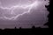 Lighting over city, thunderstorm, electricity