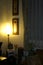 A lighting vertical lamp beside the bamboo sofa