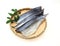 Lightly dried sliced mackerel on a bamboo colander