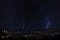 Lightning above a modern city at night - perfect for wallpapers and backgrounds