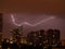 lightning on the background of the night city. storm with lightning in the city.