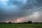 Lightning bolt strikes down on the Hungarian Plains at dusk