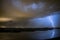 A lightning bolt strikes near a small lake in the vicinity of Rotterdam, Holland.