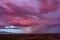 Lightning bolts strike from a distant storm