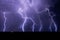 Lightning bolts strike from a storm