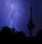 Lightning and communication tower in stormy night