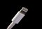 Lightning connector isolated on black background. Device charger male plug.