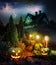 Lightning lit stormy pathway to haunted house, patio with Jack-o-Lanterns