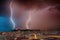 Lightning at nigh over Cagliari city. Cagliari view at night with lightning strikes.